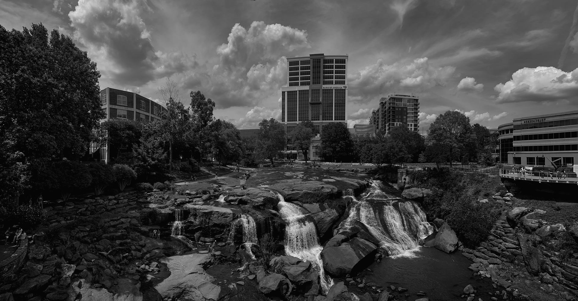 The waterfall at Falls Park on the Reedy, with downtown Greenville behind it